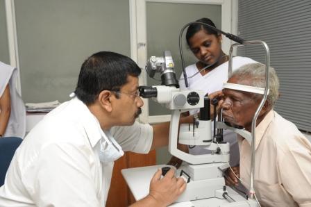 Doctor examining a patient at the slit lamp
